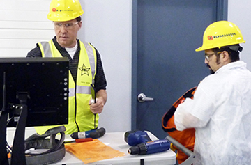 workers checking in tools before entering a foreign material exclusion zone