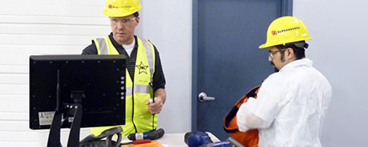 workers checking in tools before entering a foreign material exclusion zone